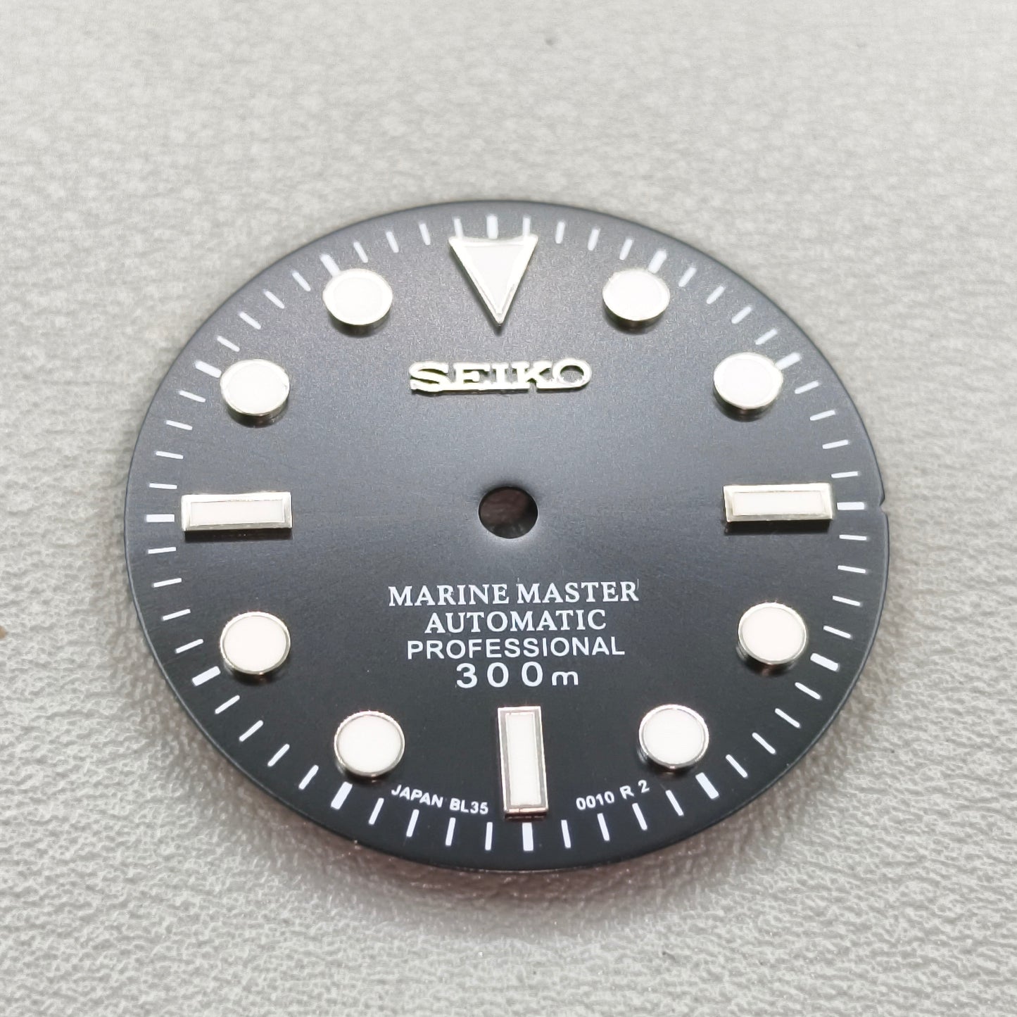 watch dial with S logo