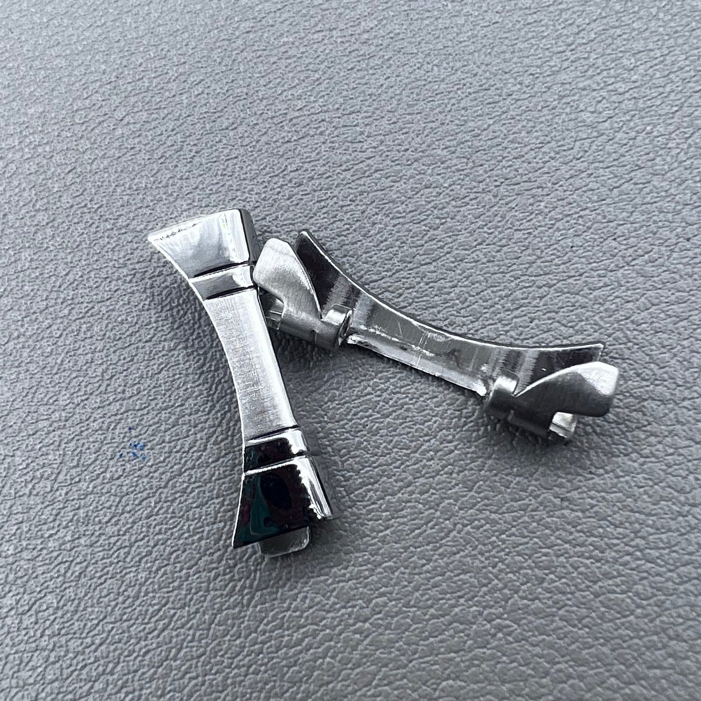 Polished curved end links spring bars set by for watch band strap replacement.