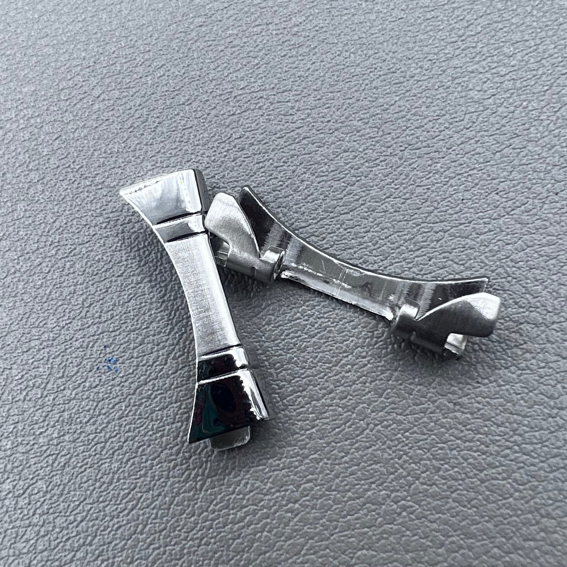 Polished curved end links spring bars set by for watch band strap replacement.