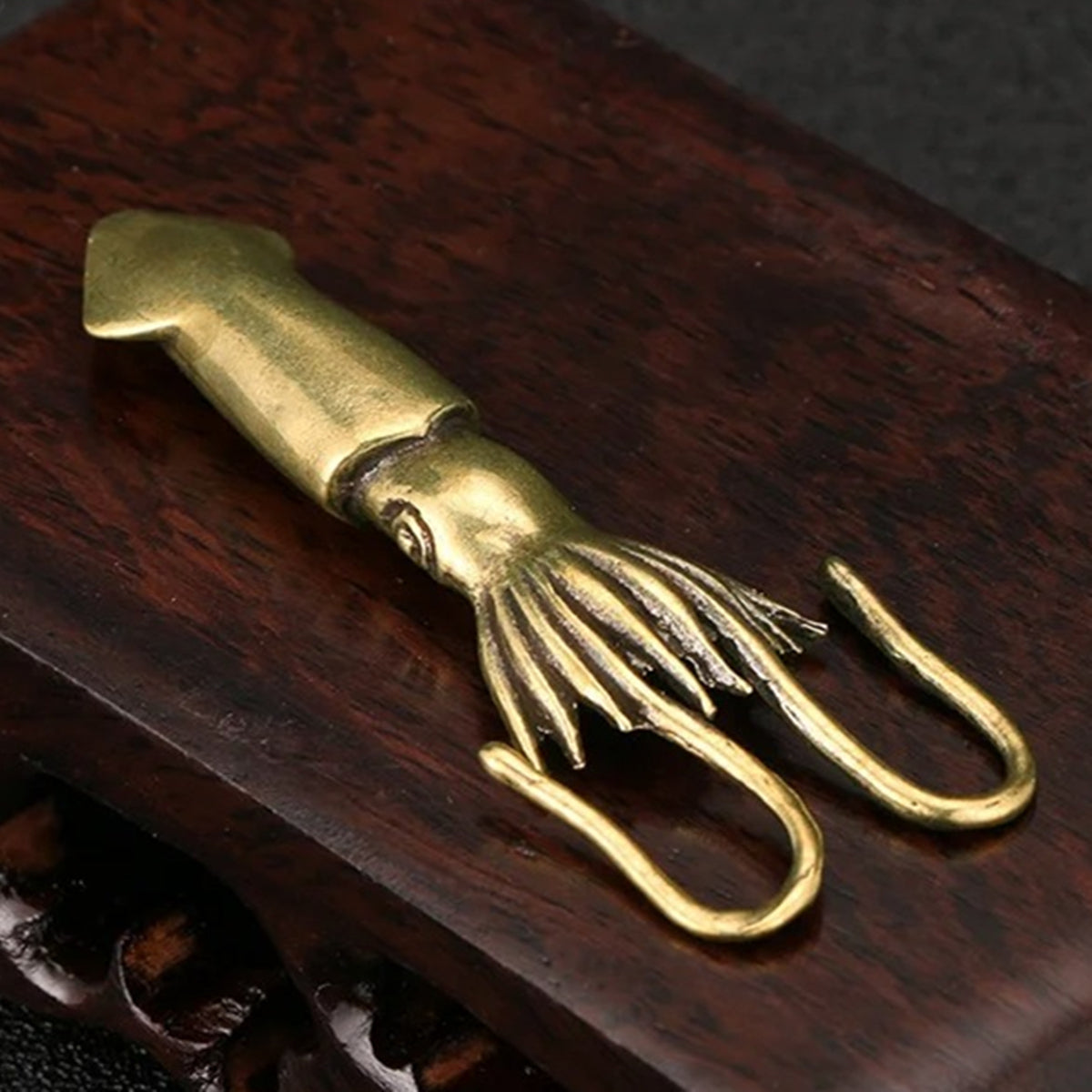 Hand-carved solid copper vintage bronze squid trinket for watch accessory display.