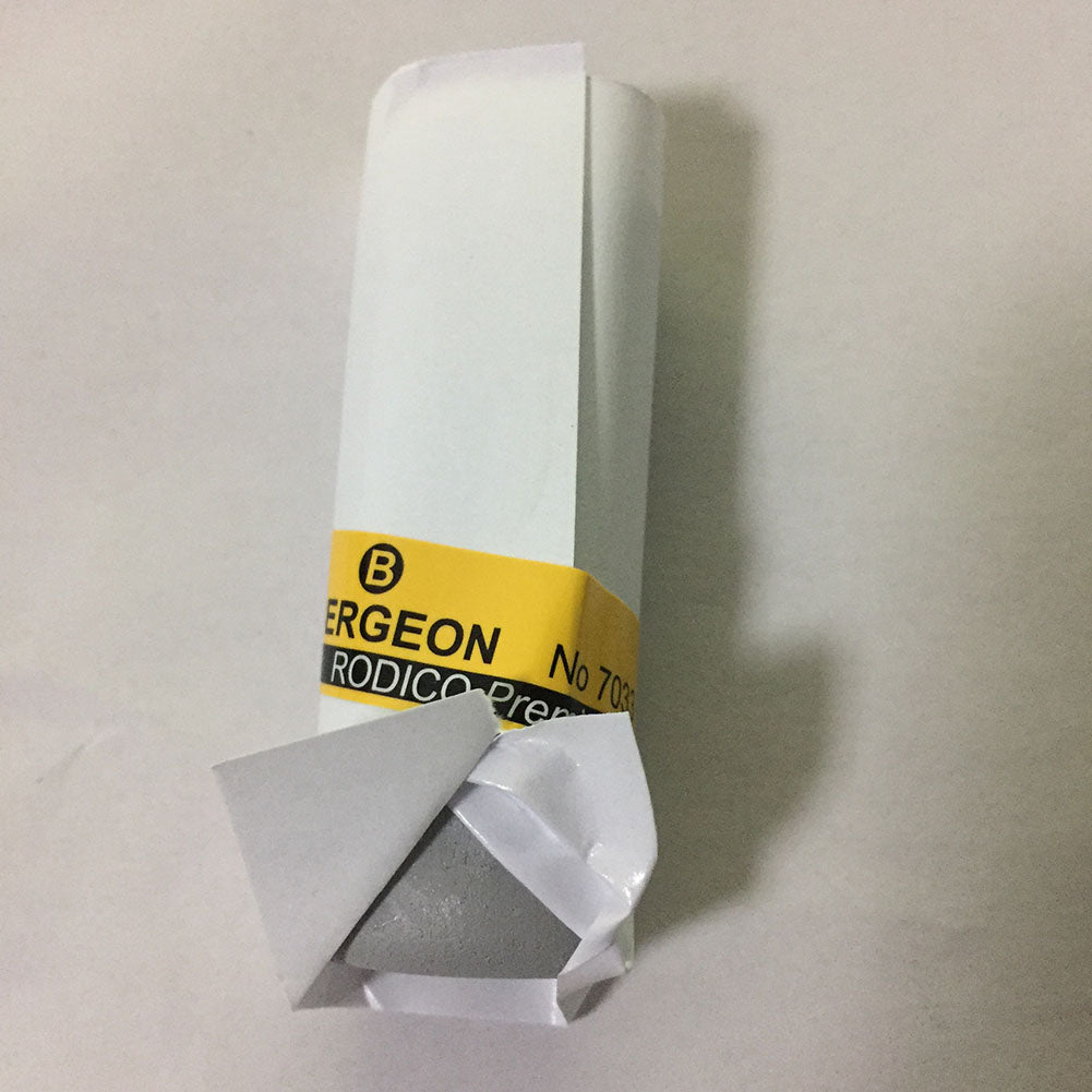 Bergeon 7033 Rodico cleaner lifting dust from watch components for precise maintenance tasks.