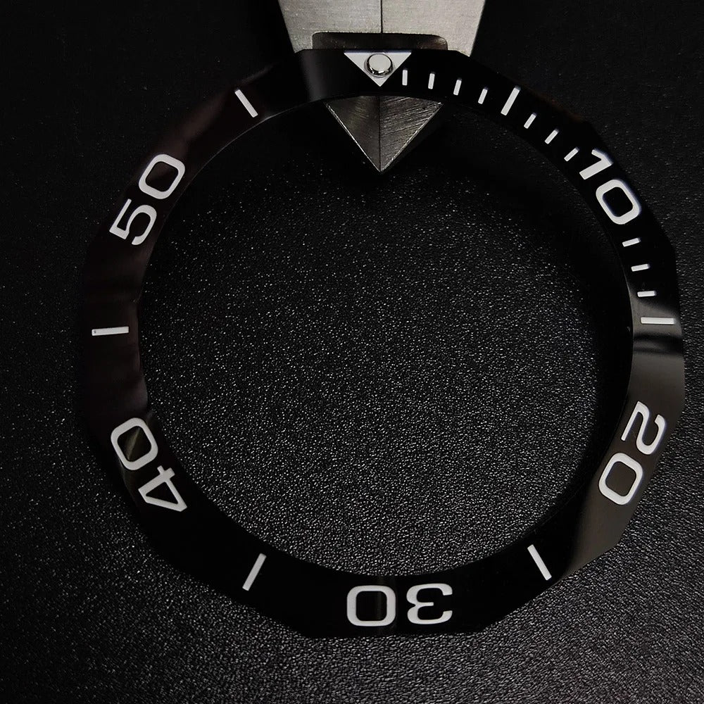 Sloping luminous ceramic bezel insert 42.3x33.3mm for automatic watch replacement, precise fit and durability.