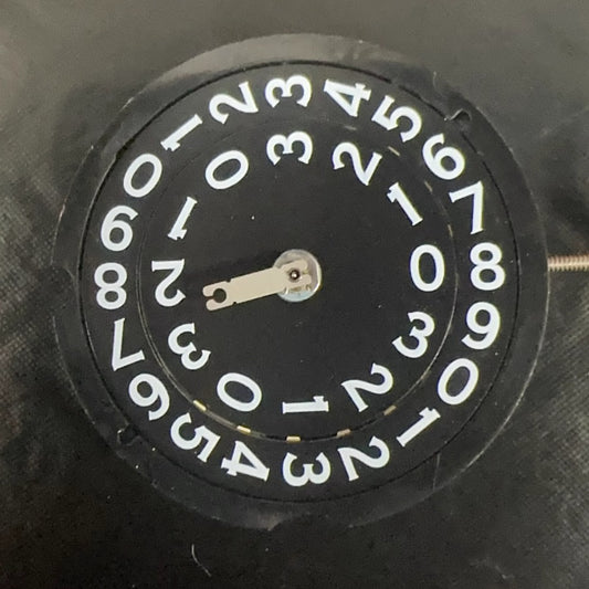 Swiss Made RODNA 509 black disk watch part with quartz movement and date display at 3 o'clock.