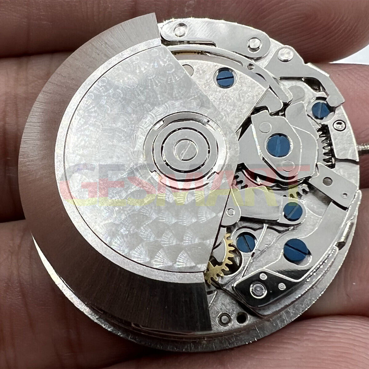 Black Dandong 7753 automatic watch movement with small second at 9, precision mechanical part by China Made.