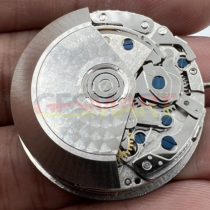 Black Dandong 7753 automatic watch movement with small second at 9, precision mechanical part by China Made.