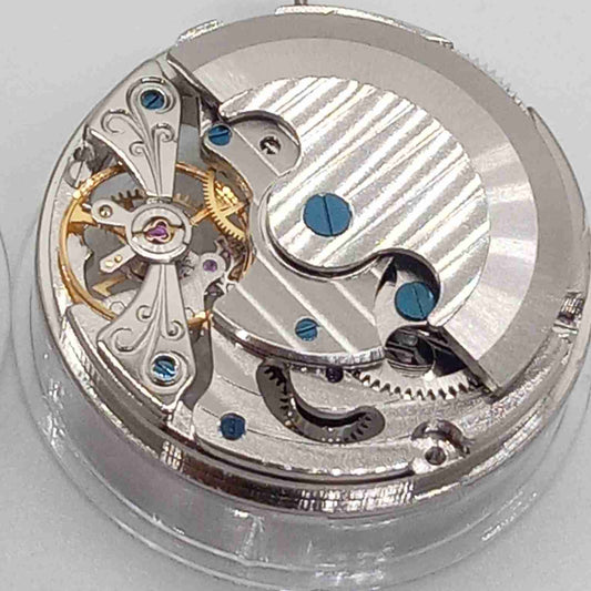 Silver hollow balance wheel with double mainspring, precise movement at 6 o'clock, ideal watch accessory.