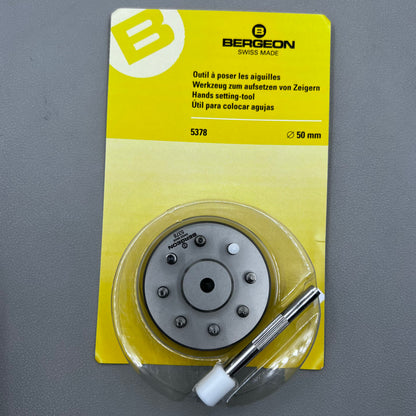 Swiss Bergeon 5378 watch hand fitting tool with 9 stakes on holder for precise hand installation.