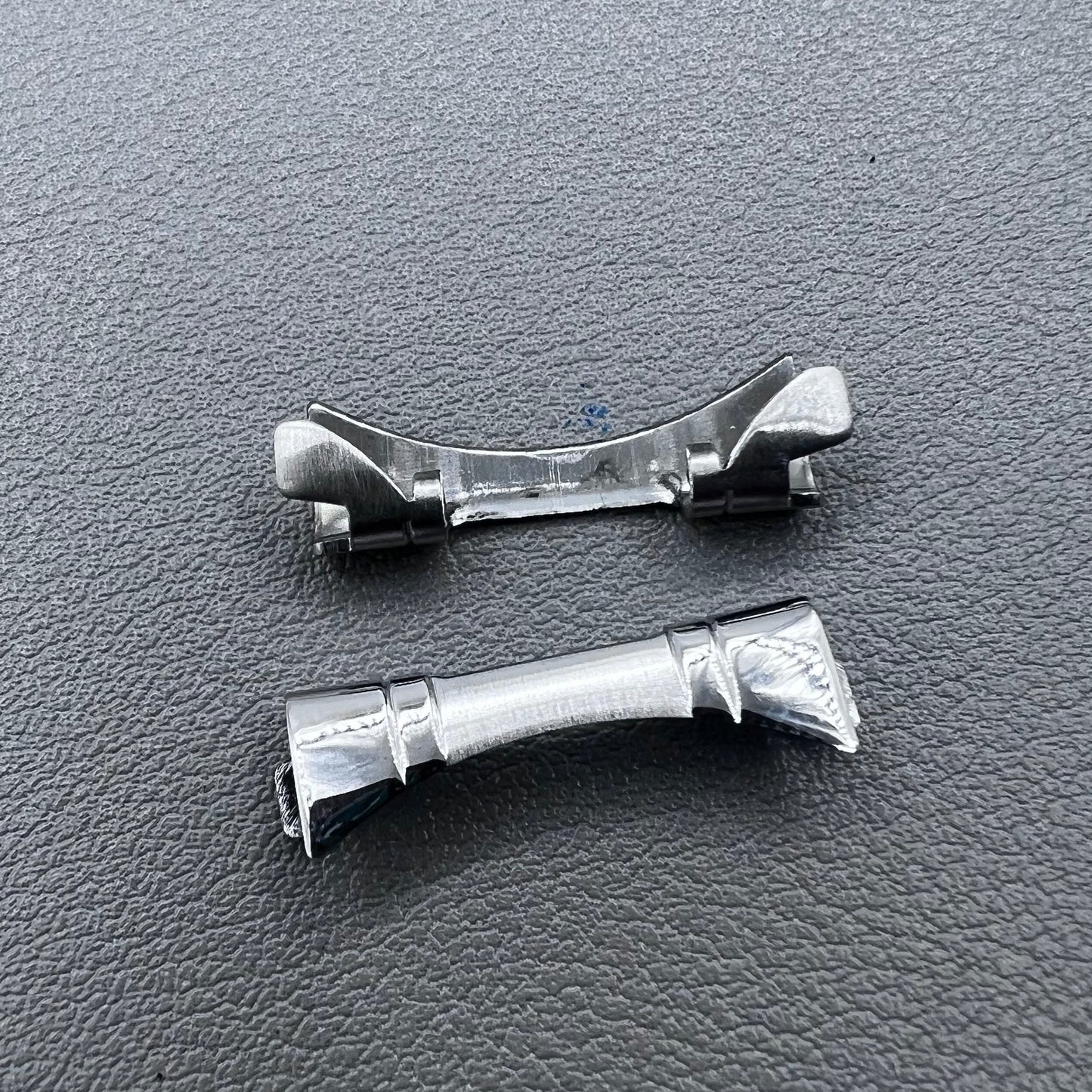 Polished curved end links spring bars set by for watch band strap replacement.