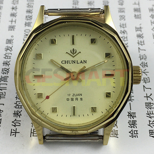 32mm China manual mechanical watch with 17 jewels, yellow dial, green lume hands.