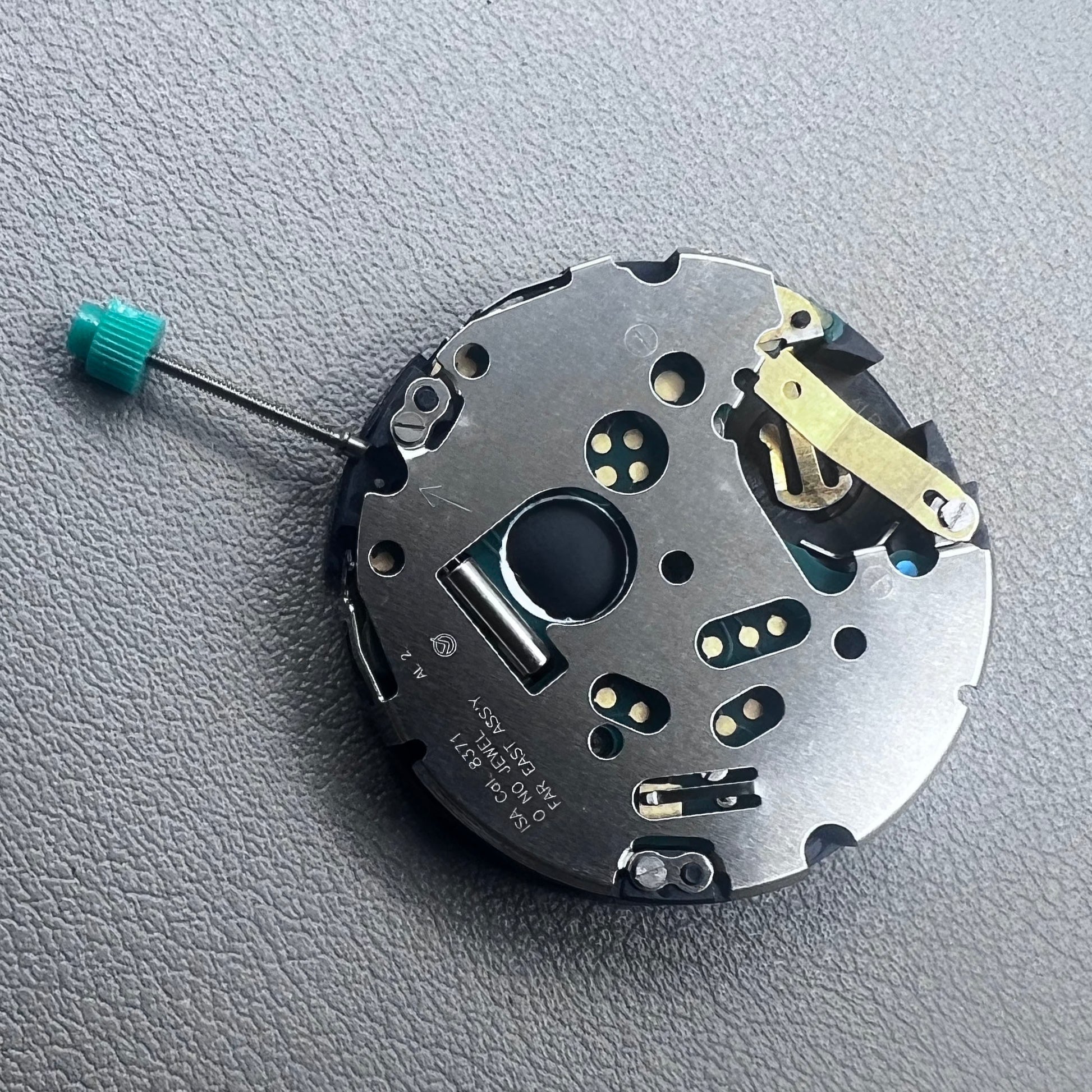 Swiss ISA 8371C quartz movement by ISA, multifunctional watch mechanism for precise timekeeping.