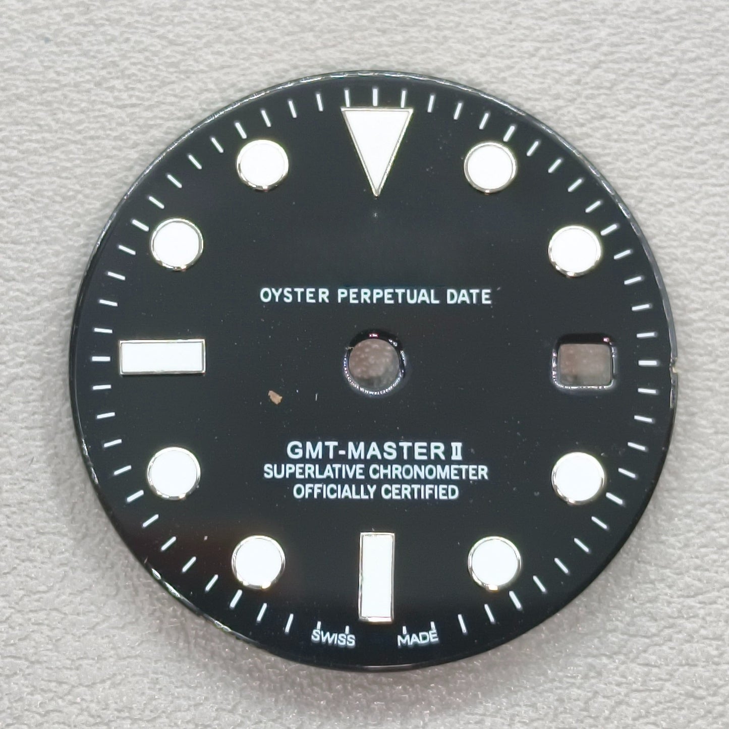 watch dial with R logo