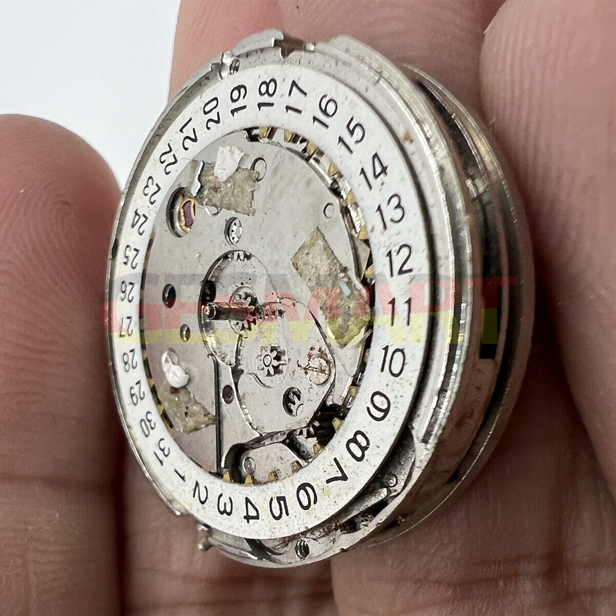 Disassembled automatic mechanical watch movement, China-made, perfect for watch repair hobbyists.