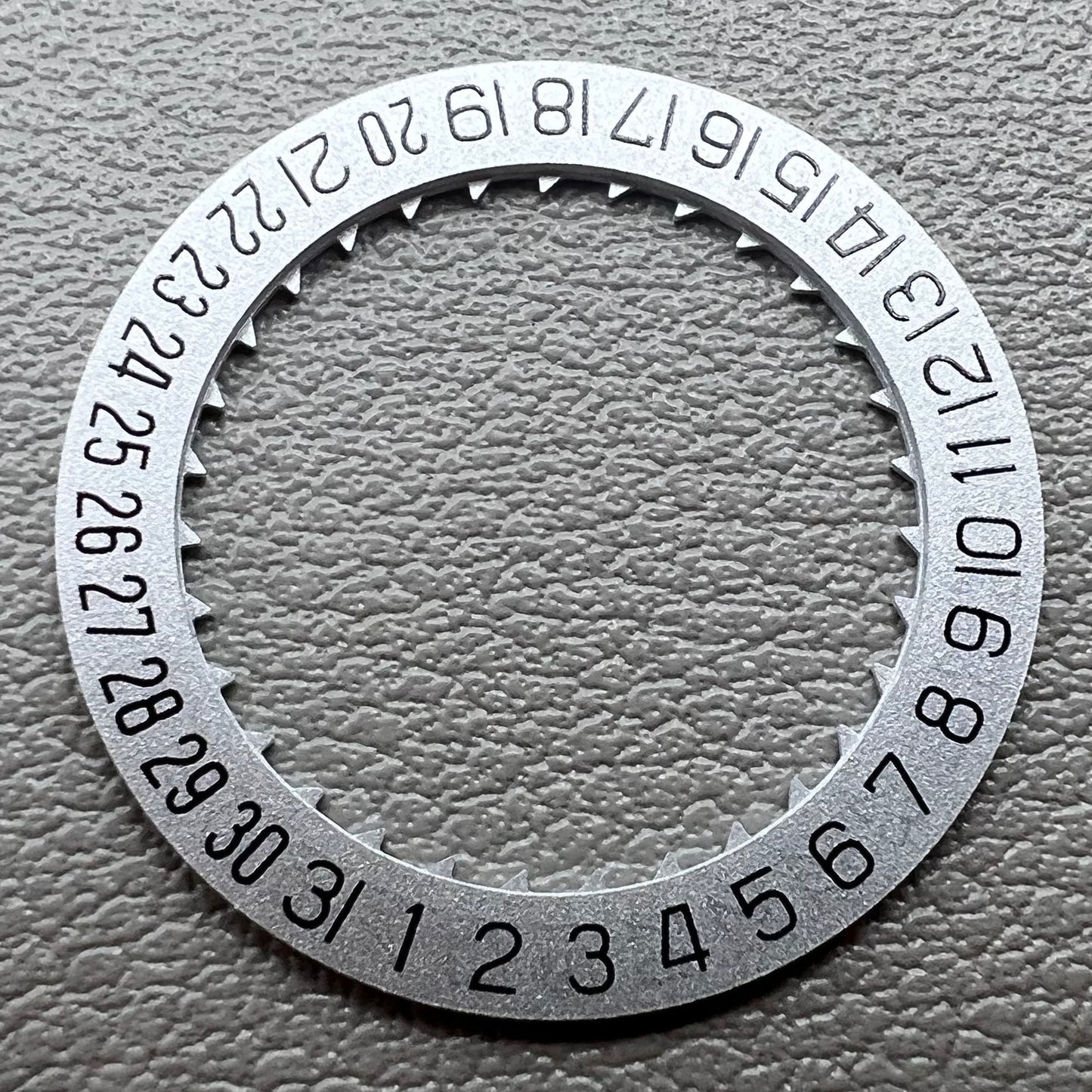Silver KA Font date wheel set for Miyota 8215 watch movement, enhancing precision and style.