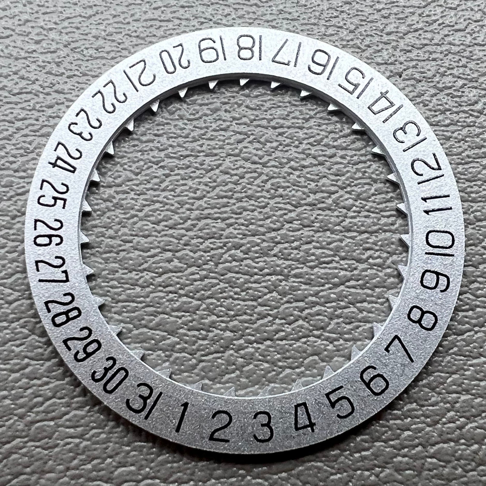 Silver KA Font date wheel set for Miyota 8215 watch movement, enhancing precision and style.