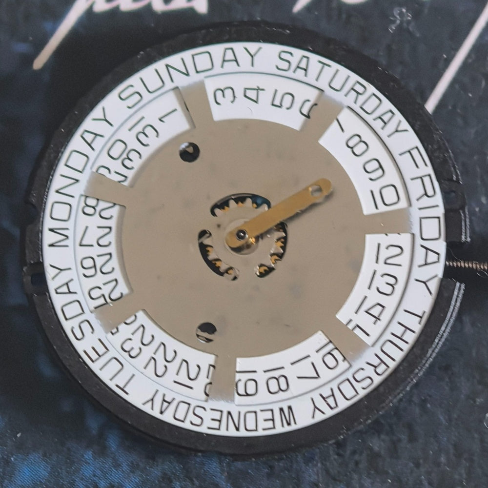 Swiss ETA805.144 quartz movement with silver disk, 3 hands; precision watch part by ETA for repairs