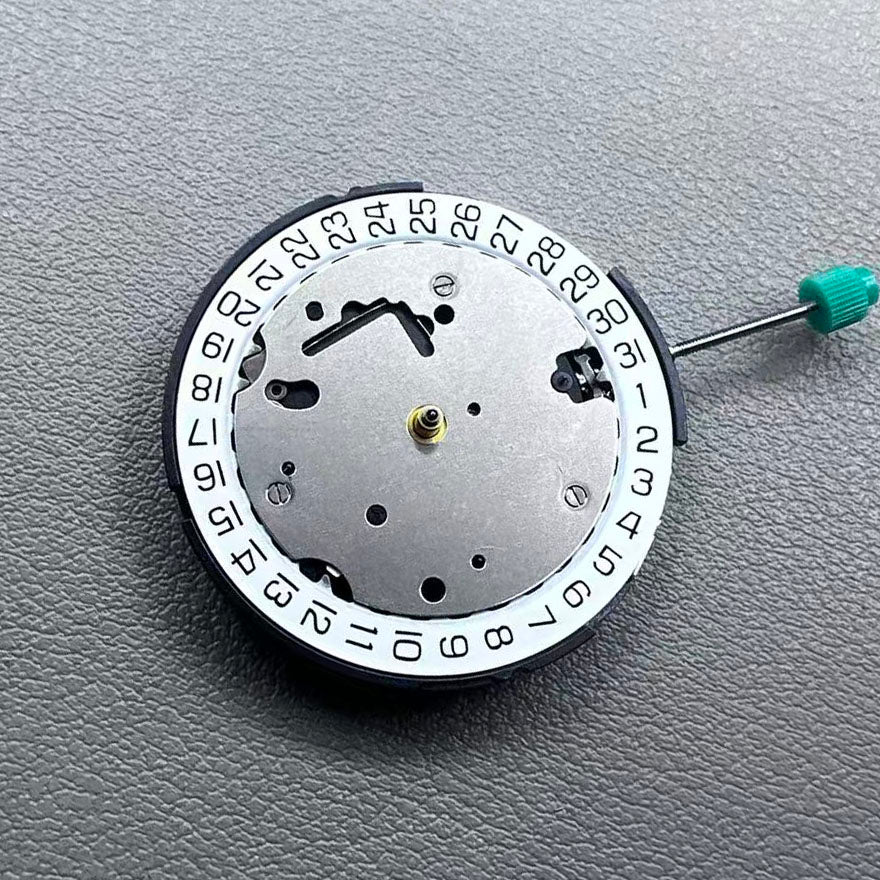 Swiss ISA 8371B quartz watch movement with date at 3 o'clock, white disk, silver-plated finish, precision timekeeping.
