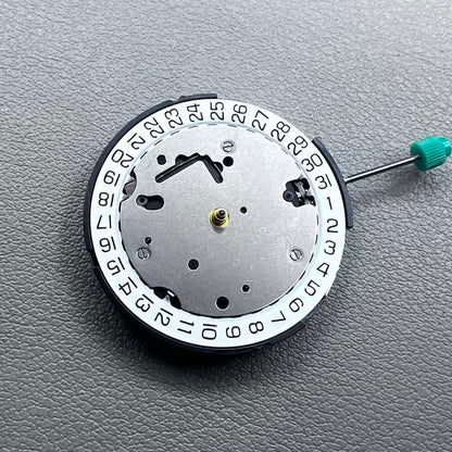 Swiss ISA 8371B quartz watch movement with date at 3 o'clock, white disk, silver-plated finish, precision timekeeping.