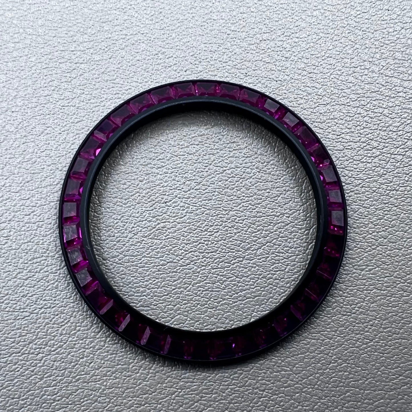 Purple T-shaped square Moissanite bezel for Daytona watch, inclined design enhancing luxury style.