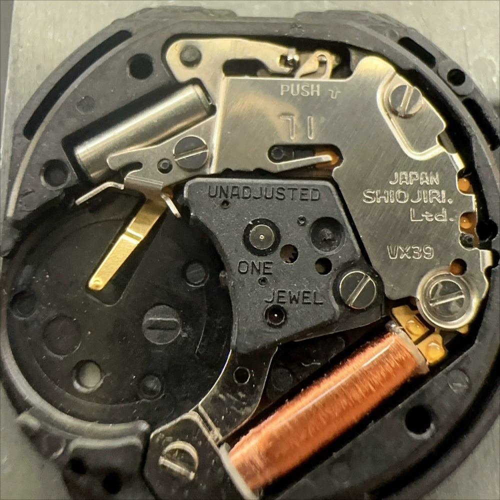 Japan Made VX39 quartz watch movement showing 3 hands and single calendar date at 3 o'clock position.