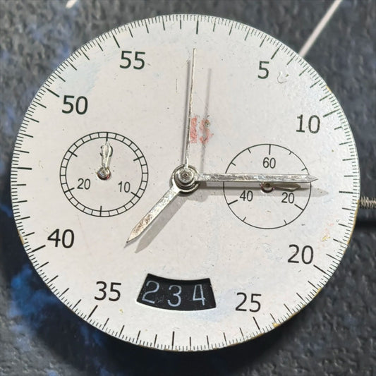 Dandong 7750 mechanical watch movement with black date disk at 3 o'clock, precision engineering.