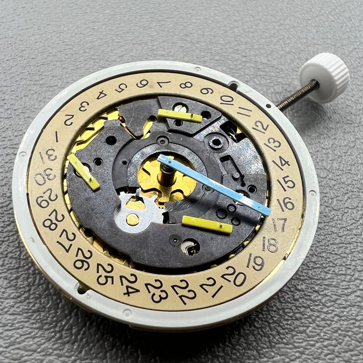 Swiss ISA 8162 golden watch disk with date feature, quartz movement replacement by ISA, ideal for watch repair.