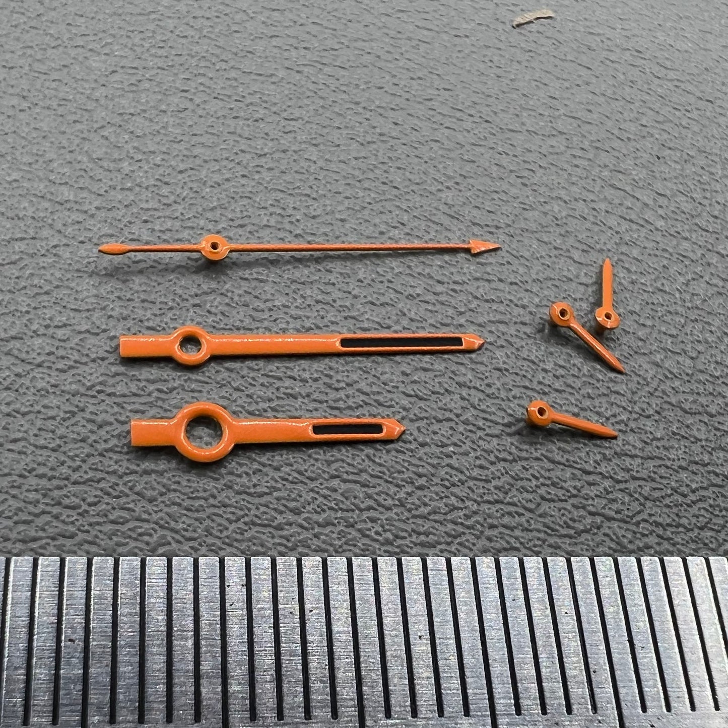 Orange-trimmed black watch hands with green lume, compatible with VK63 movement, perfect for precise timekeeping.