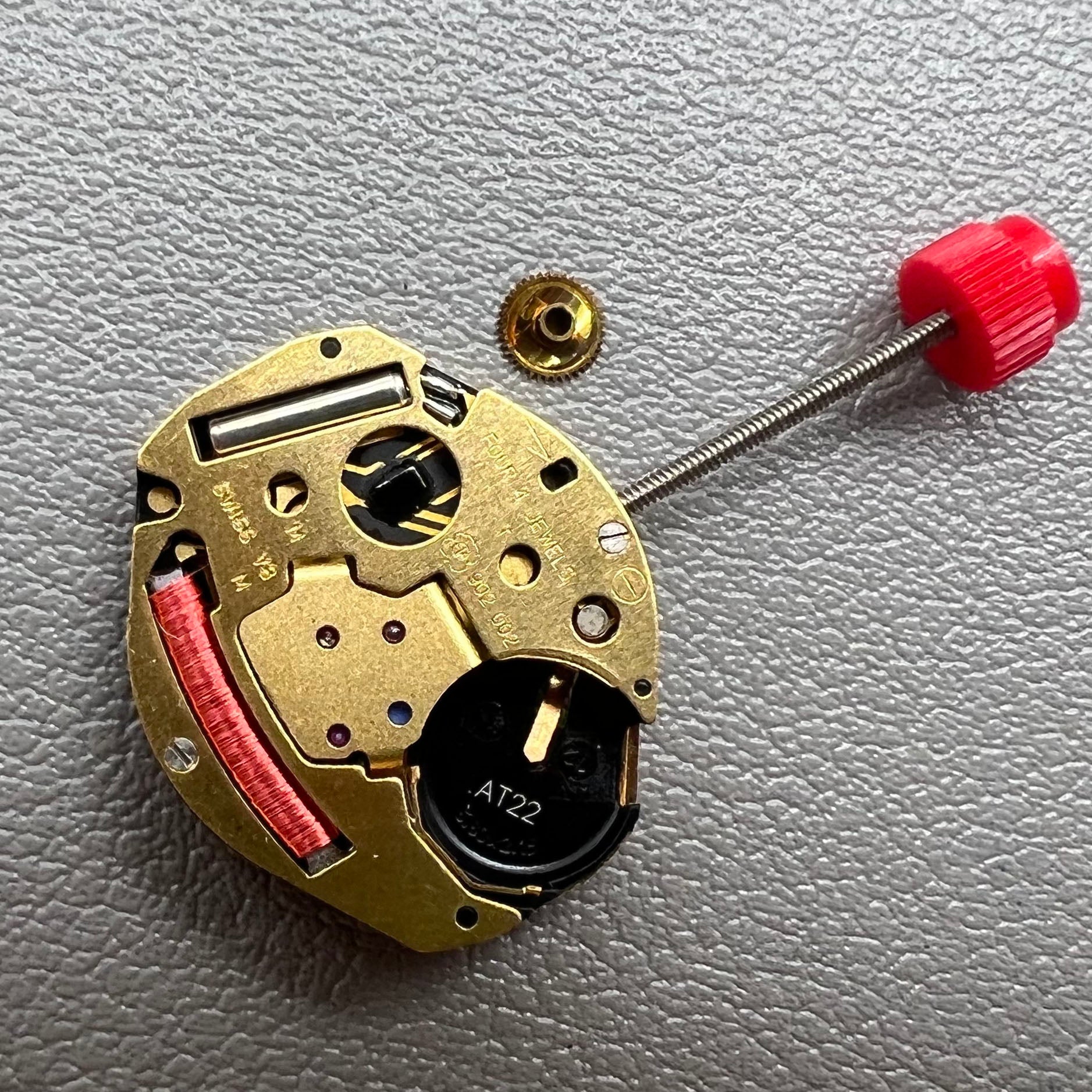 Swiss ETA 902.002 quartz watch movement with two hands, precision engineering by ETA.