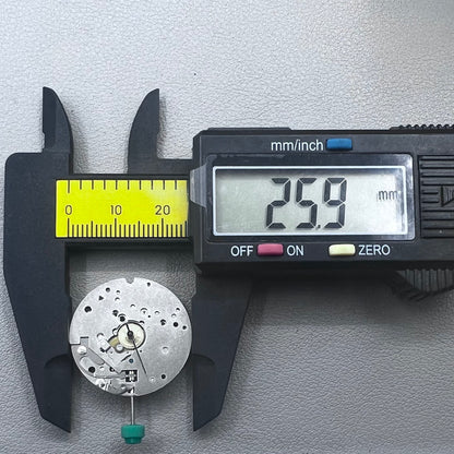 Swiss ETA 6640B quartz watch movement with 3 hands and black circuit board for precise timekeeping.