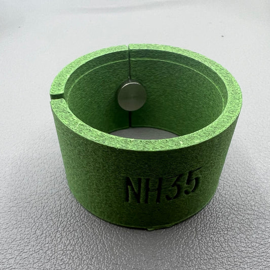 Watch movement holder securely holding Seiko NH35 movement for precise assembly and repair.