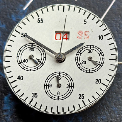 Chinese Dandong 7750 watch movement showcasing big date at 12 and small seconds at 9 in high detail.