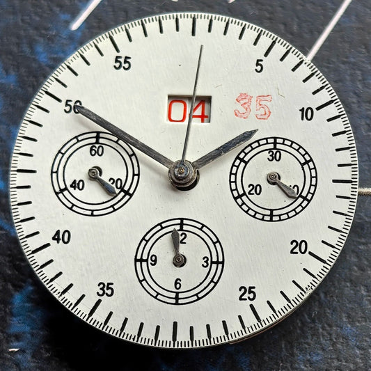 Chinese Dandong 7750 watch movement showcasing big date at 12 and small seconds at 9 in high detail.