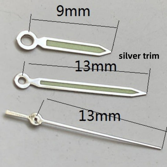 Silver trimmed green luminous watch hands set for Ronda 515 quartz movement, enhancing readability and style.
