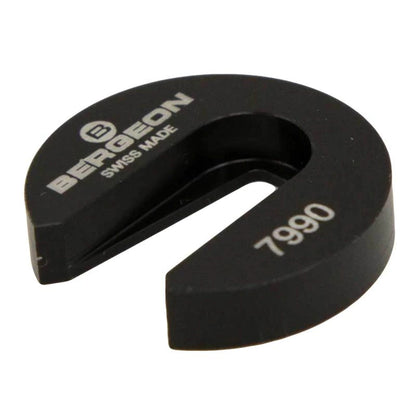 Bergeon 7990 tool holding balance wheel impulse-pin for precise watch cleaning.