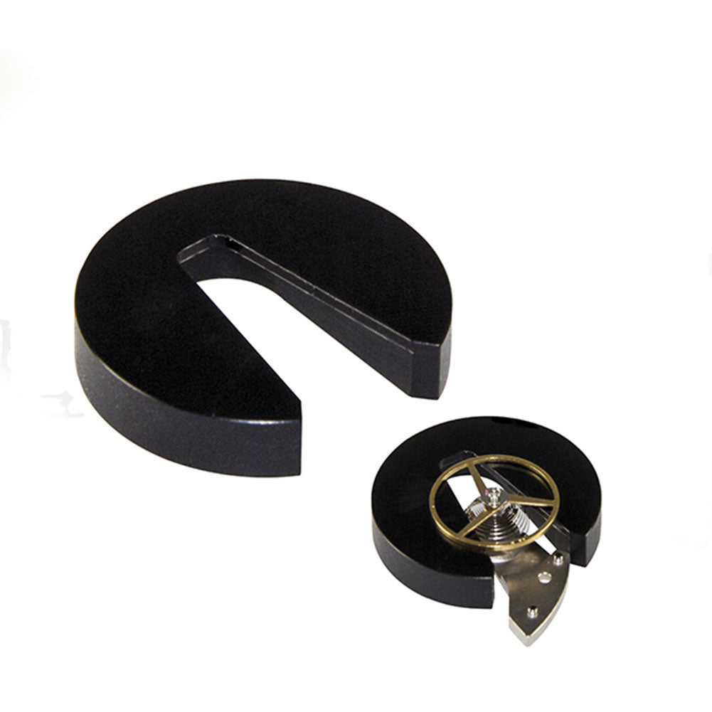 Bergeon 7990 watchmaker tool supporting balance wheel impulse-pin during cleaning.