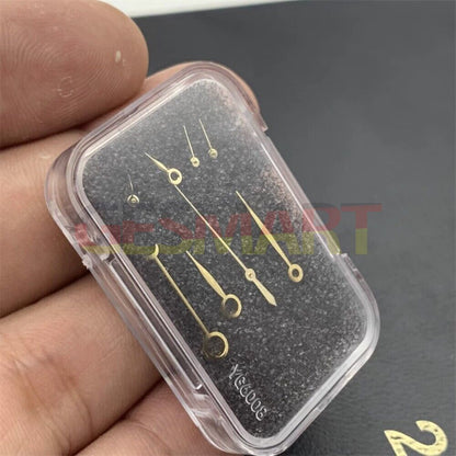 Blue, silver, and gold watch hands set for ETA7751 movement, precision repair parts.