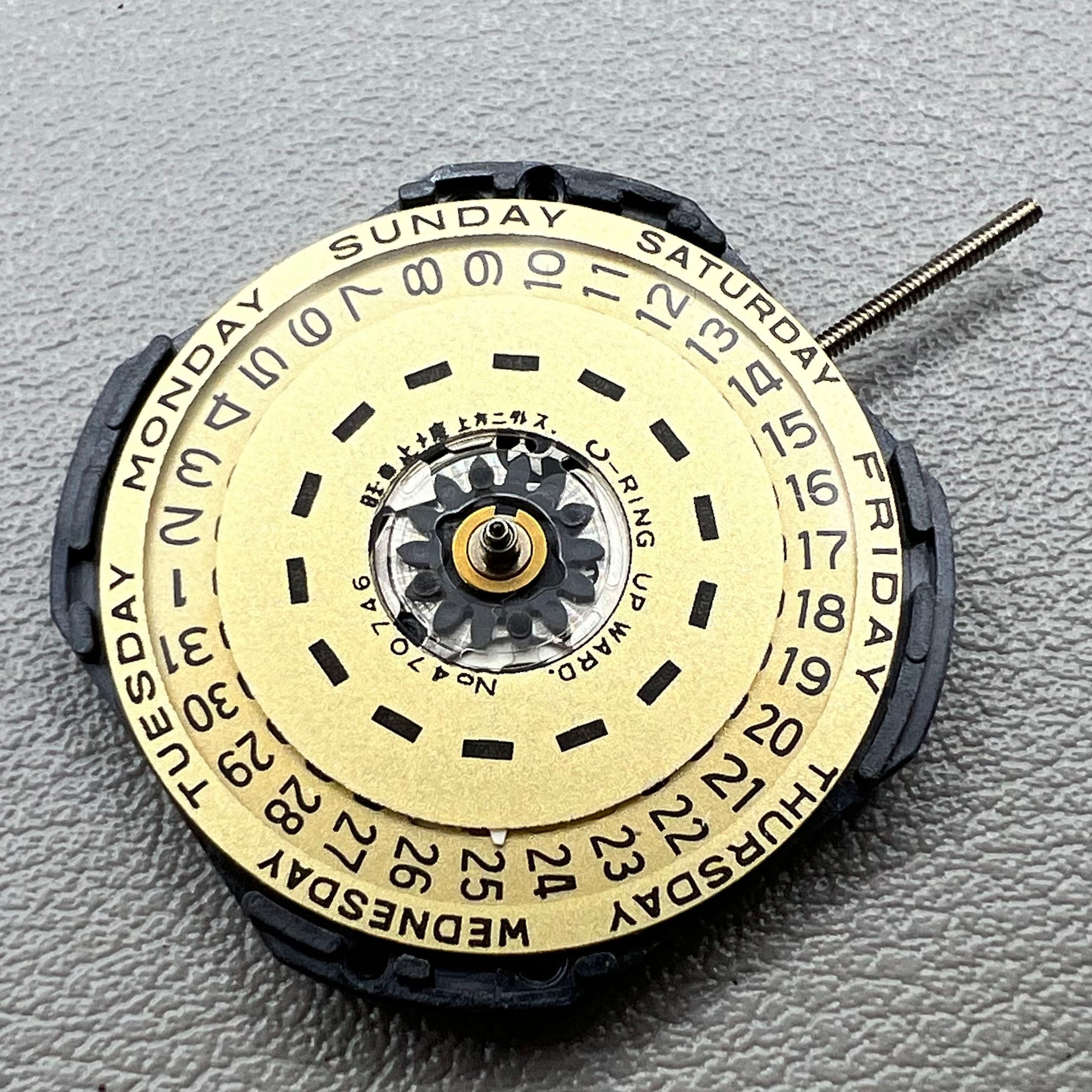 YL44A Quartz watch movement with double calendar and 3 hands, branded for precise timekeeping.