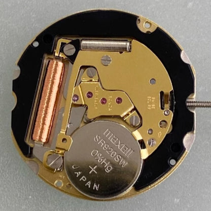 Swiss Made Ronda 702 quartz movement watch part with two golden gilted hands for precision timekeeping.