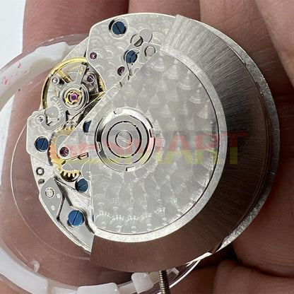 Black Dandong 7753 automatic watch movement with small second at 9, precision mechanical by China Made for watch repairs.