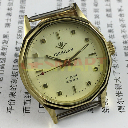 32mm China manual mechanical watch with 17 jewels, yellow dial, green lume hands for classic timekeeping.