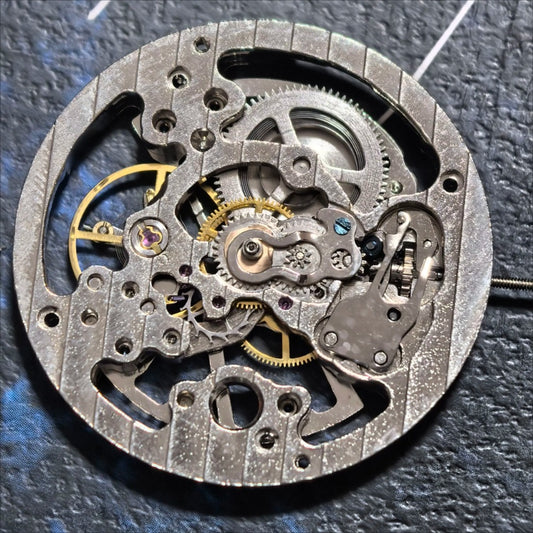 Hollow silver manual winding watch movement part by China Made, precise mechanical accessory for repair.