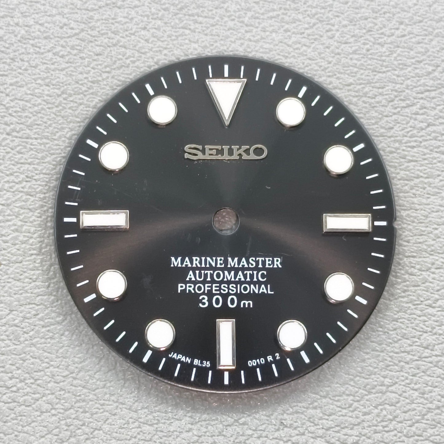 watch dial with S logo