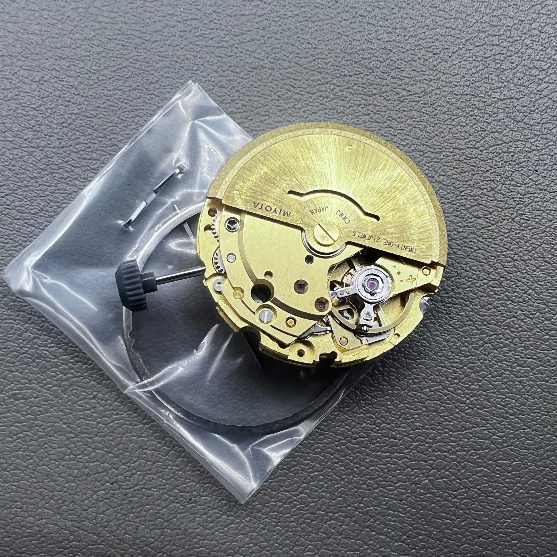 Golden plated Japan Miyota 8205 automatic mechanical watch movement, precision timekeeping component.