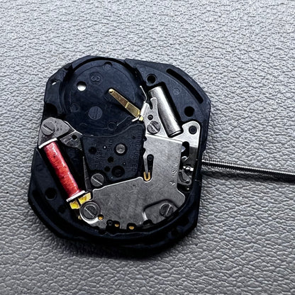 Japan VX22 quartz watch movement with date at 3 o'clock, white disk replacement for precision.