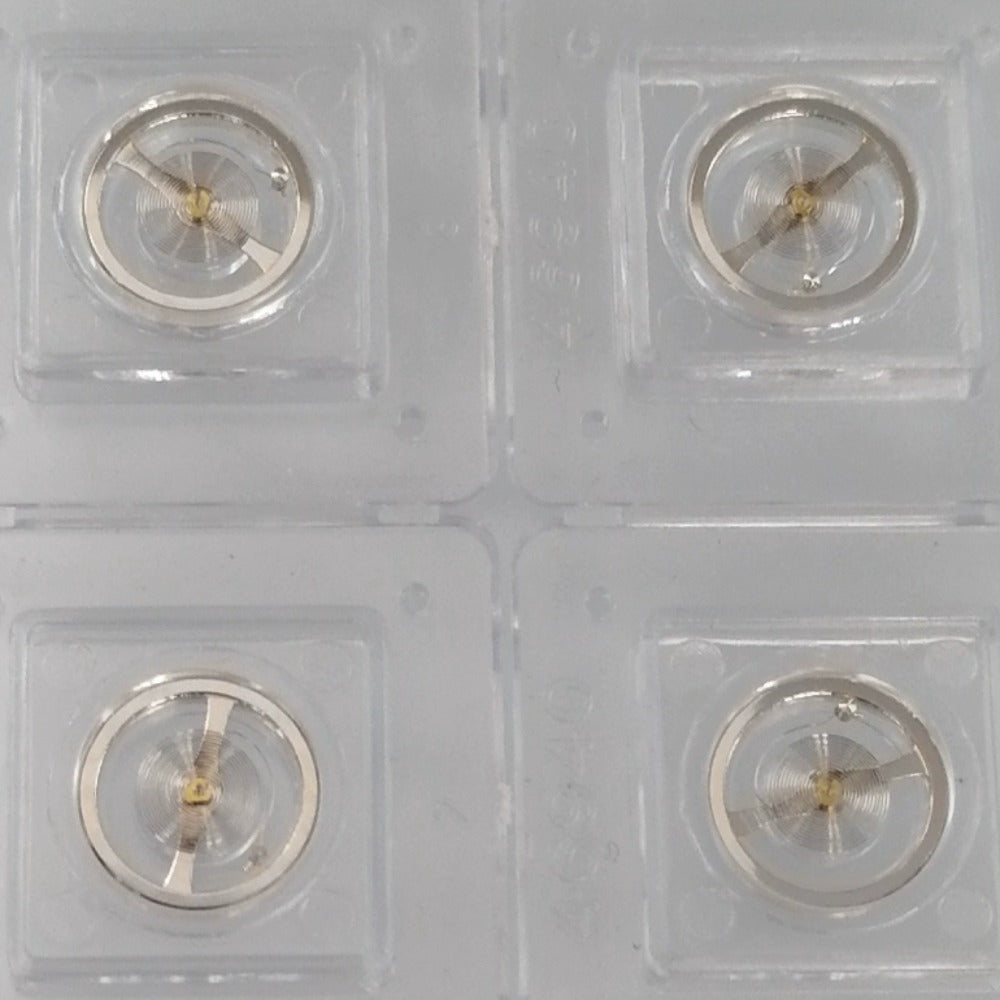 Set of 3 silver balance wheels for 7009 movement, precision components made in China for watch repair.