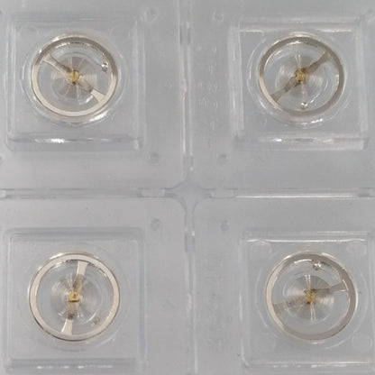 Set of 3 silver balance wheels for 7009 movement, precision components made in China for watch repair.