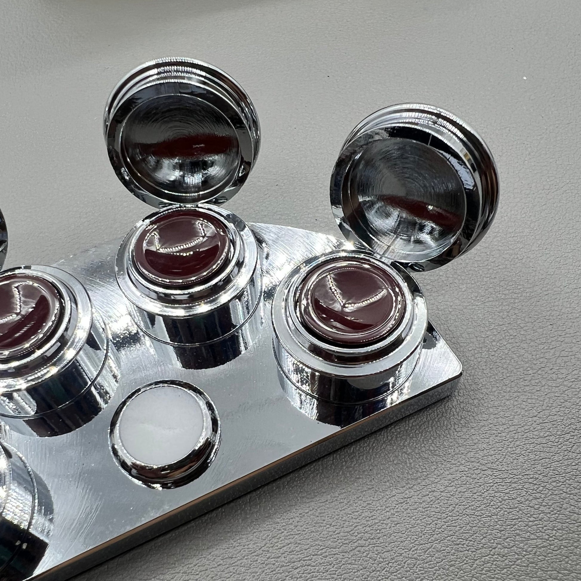 BG 30180-A stainless steel watch oil cup stand with 4 covered oiler dishes for precise watch repair.