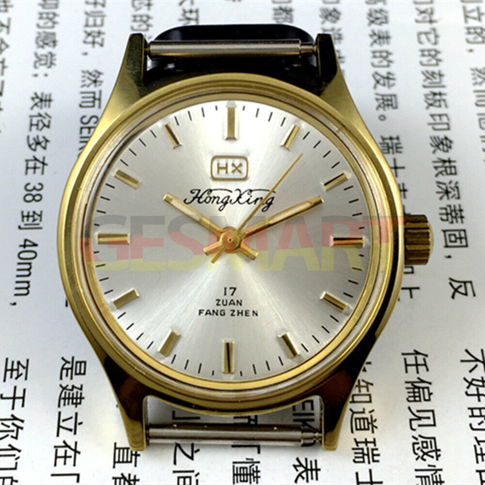 33mm China-made manual mechanical watch with golden hour markers on silver dial, shock-resistant design.