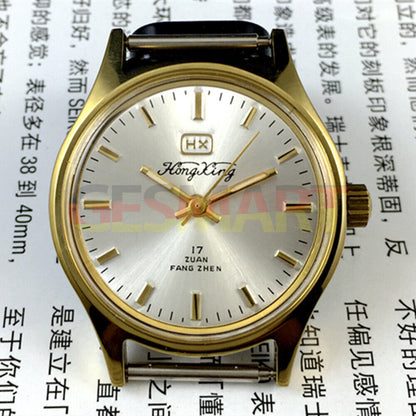 33mm China-made manual mechanical watch with golden hour markers on silver dial, shock-resistant design.