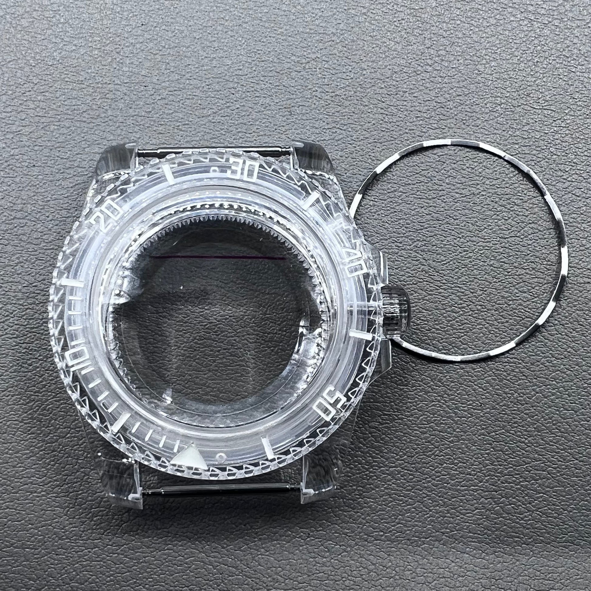 40MM green luminous plastic watch case with acrylic mirror for 8215 8200 821A 2813 movements, durable and lightweight.