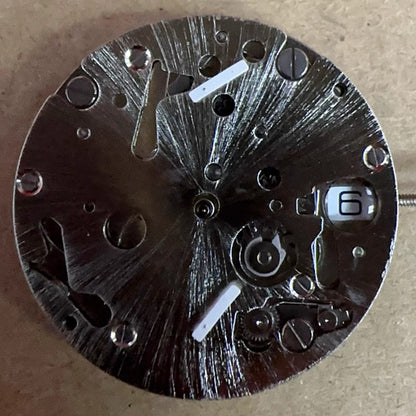 Swiss Made ISA9232 quartz movement watch part with five silver hands for precise timekeeping.